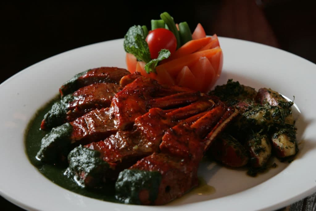 Roasted Kamala Lamb With Herbs and Mint Jelly