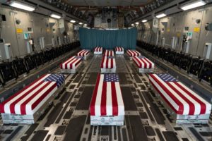 Flag-covered US caskets on plane
