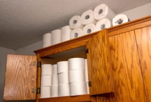 Home owner stocking up on toilet paper due to the coronavirus pandemic and the empty shelves in the stores.
