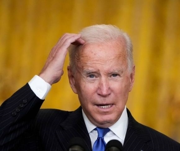 Omicron Variant Prompts Biden to Revive Trump’s ‘Racist’ Policy