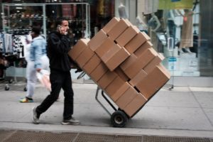 GettyImages-1316117239 man carrying boxes
