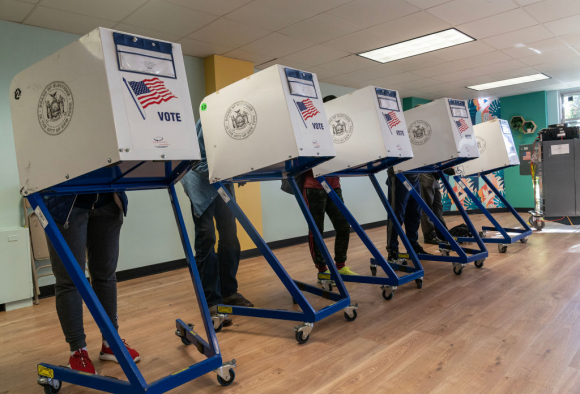 People seen voting at a polling station in the Bronx on