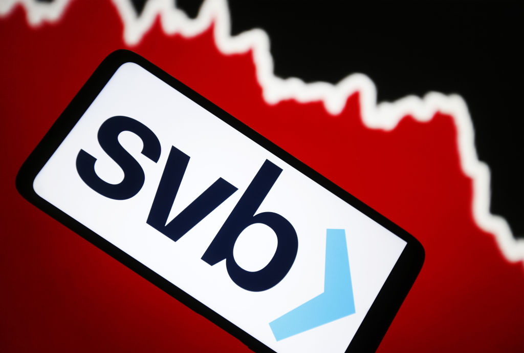 In this photo illustration, Silicon Valley Bank (SVB) logo