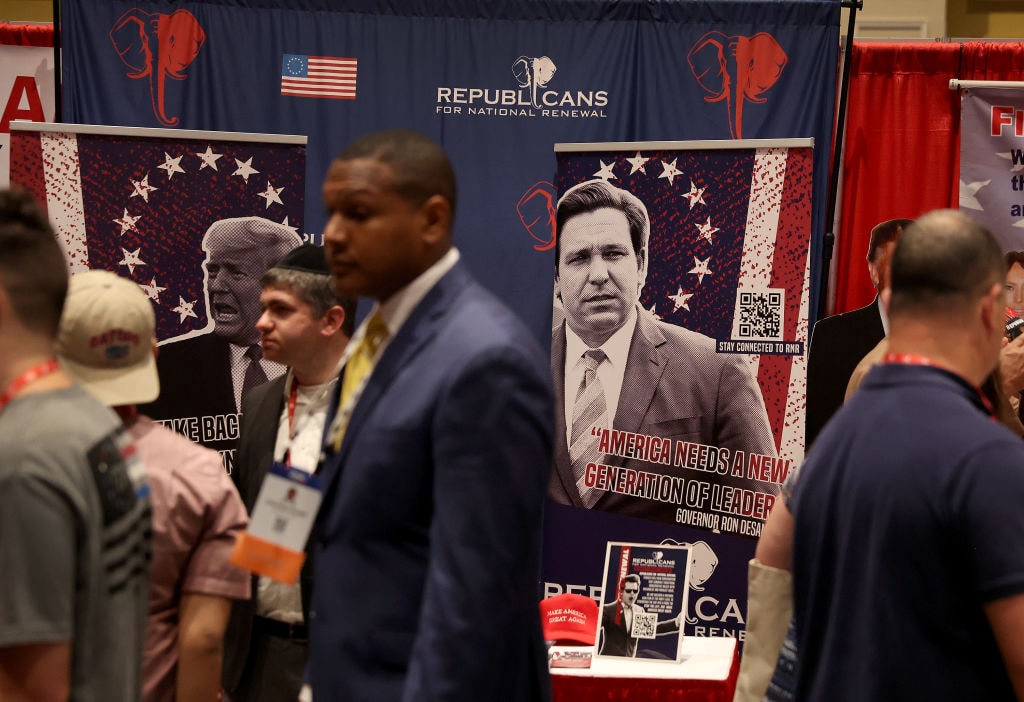 American Conservative Union Holds Annual CPAC Conference In OrlandoORLANDO, FLORIDA - FEBRUARY 24: Posters of former U.S. President Donald Trump and Florida Gov. Ron DeSantis hang in a booth at the Conservative Political Action Conference (CPAC) at The Rosen Shingle Creek on February 24, 2022 in Orlando, Florida. CPAC, which began in 1974, is an annual political conference attended by conservative activists and elected officials. (Photo by Joe Raedle/Getty Images)