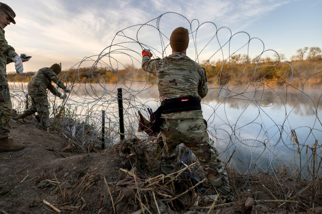 What Remains Following An Immigrant Surge At The BorderEAGLE PASS, TEXAS - JANUARY 10: Texas National Guard soldiers install additional razor wire lie along the Rio Grande on January 10, 2024 in Eagle Pass, Texas. Following a major surge of migrant border crossings late last year, miles of razor wire as well as huge quantities of refuse remain along the U.S.-Mexico border at Eagle Pass. (Photo by John Moore/Getty Images)