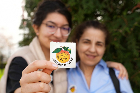Georgia Special Election Held To Replace Marjorie Taylor Greene's House Seat DALTON, GEORGIA - MARCH 10: Layla Al-Mondalek and Jeanne Nassif pose for a photo with their voting sticker on Election Day for Congressional district 14, on March 10, 2026 in Dalton, Georgia. The special election is being held to fill a seat that opened up after Marjorie Taylor Greene left Congress in January of this year. (Photo by Megan Varner/Getty Images)
