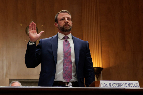 Senate Holds Confirmation Hearing For DHS Secretary Nominee Markwayne Mullin WASHINGTON, DC - MARCH 18: U.S. Sen. Markwayne Mullin (R-OK) is sworn in as he testifies during a confirmation hearing to be the next Secretary of the Department of Homeland Security in the Dirksen Senate Office Building on March 18, 2026 in Washington, DC. President Trump nominated Mullin to replace Kristi Noem as DHS Secretary. (Photo by Chip Somodevilla/Getty Images)